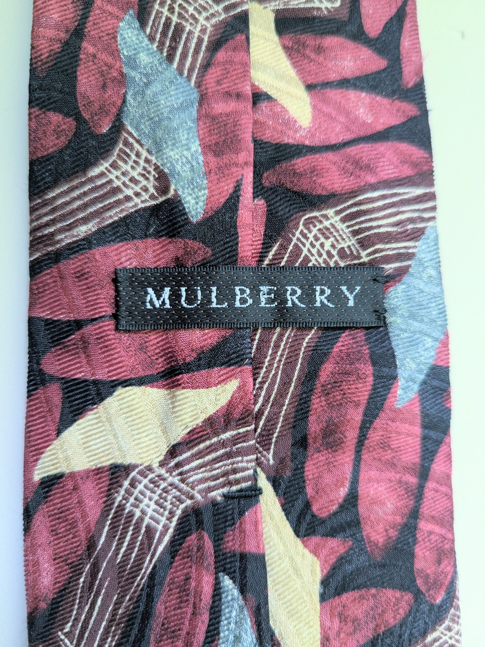 Mulberry Multicolor Leaf-Pattern Silk Tie in Red, Brown, Black, Grey and Cream